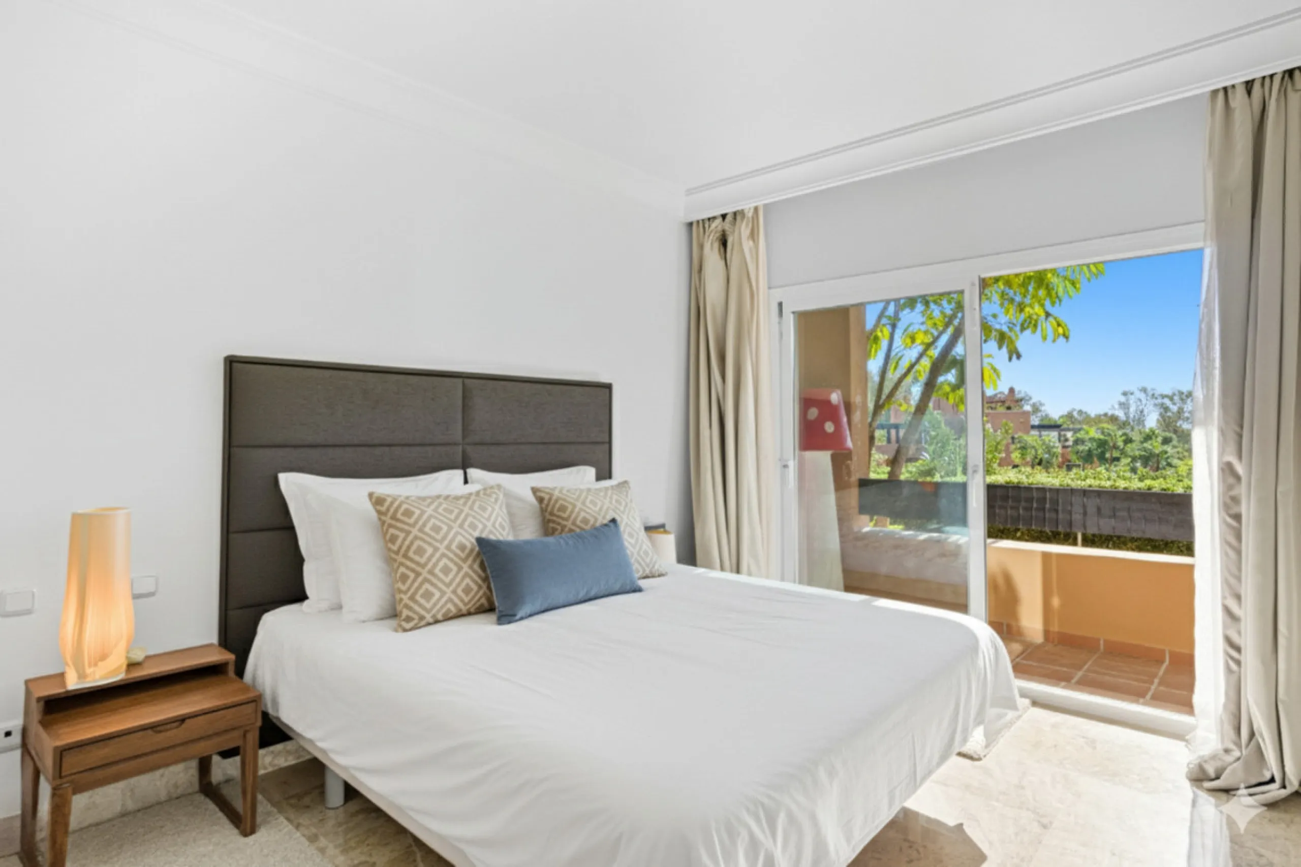 Elegant ground-floor apartment located in one of the most exclusive and peaceful developments in Nueva Andalucía. This carefully maintained property offers the perfect blend of comfort, privacy, and Mediterranean charm. It features two spacious bedrooms a