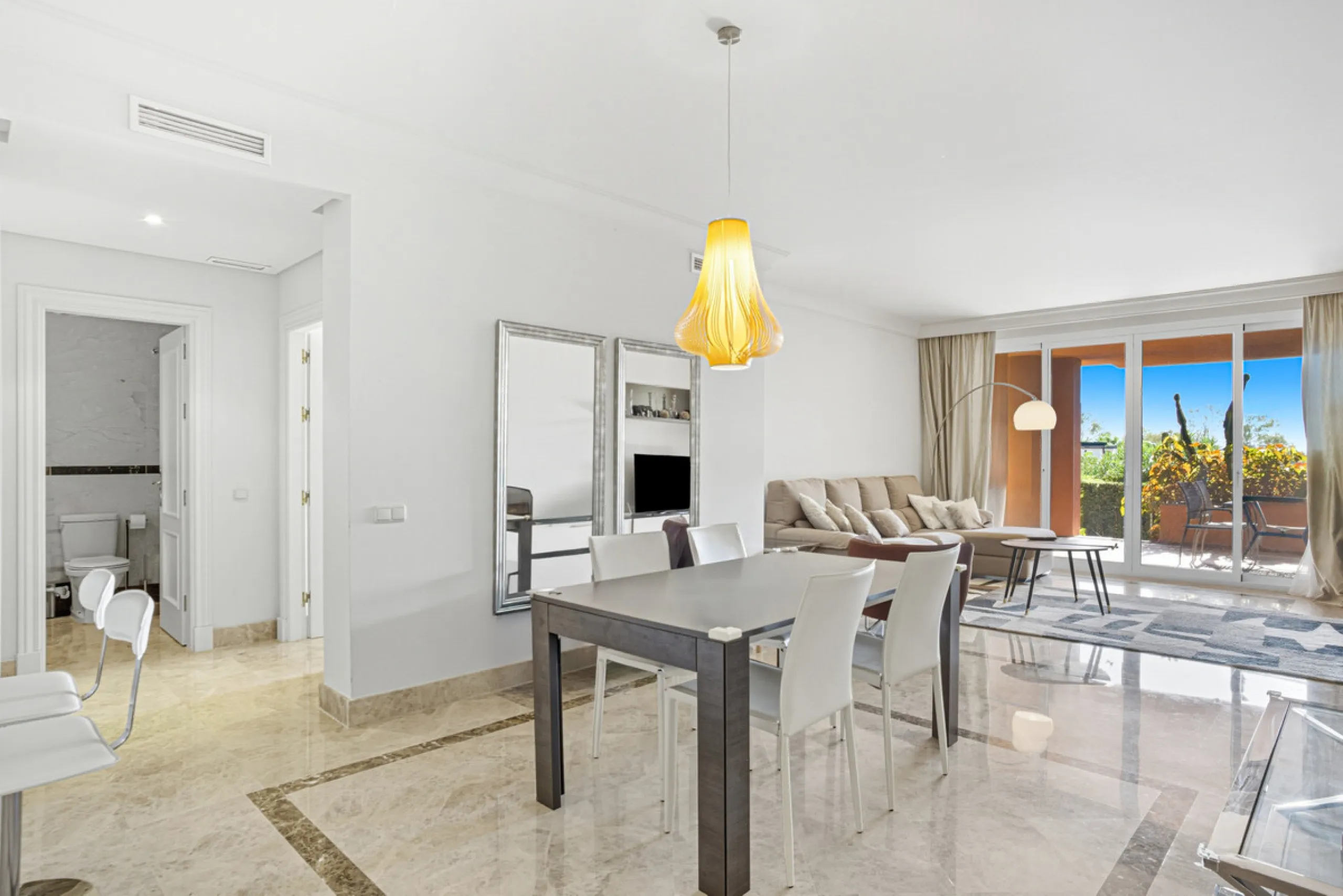 Elegant ground-floor apartment located in one of the most exclusive and peaceful developments in Nueva Andalucía. This carefully maintained property offers the perfect blend of comfort, privacy, and Mediterranean charm. It features two spacious bedrooms a