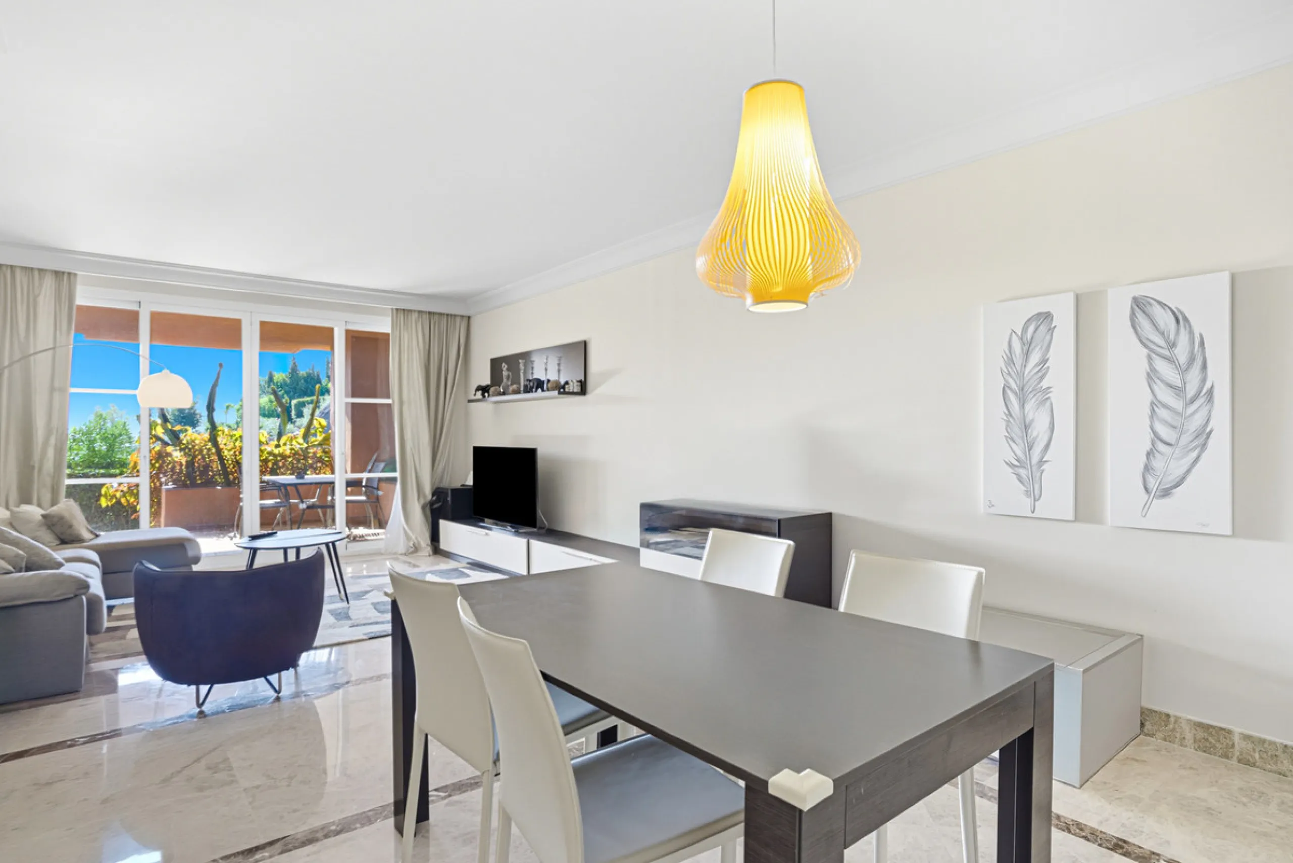 Elegant ground-floor apartment located in one of the most exclusive and peaceful developments in Nueva Andalucía. This carefully maintained property offers the perfect blend of comfort, privacy, and Mediterranean charm. It features two spacious bedrooms a