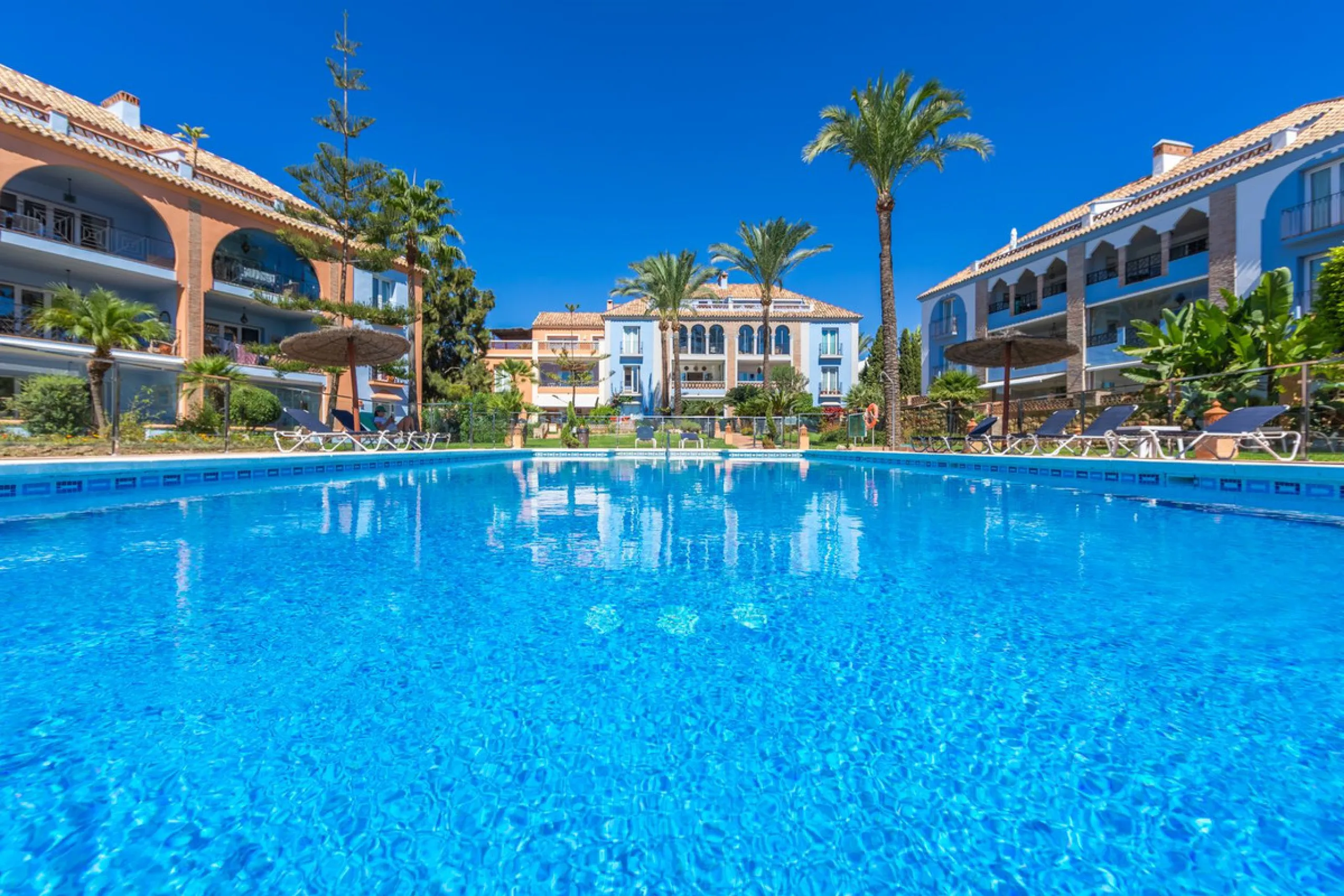 Stunning mid-floor apartment in the first line of the beach, with spectacular views of the sea, the beach, Gibraltar, and Africa, located in the exclusive Bay of Casares next to a protected historic area with an ancient Arab tower, within the prestigious 