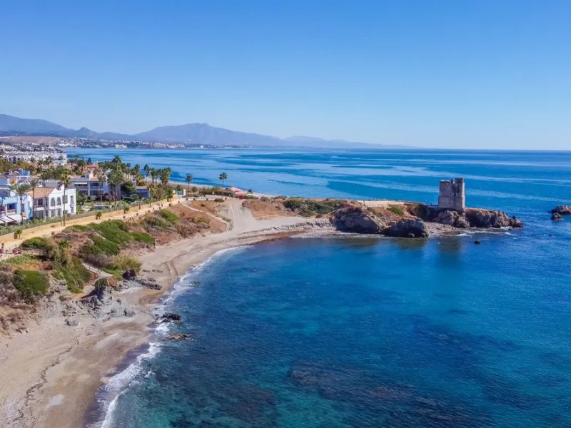 Stunning mid-floor apartment in the first line of the beach, with spectacular views of the sea, the beach, Gibraltar, and Africa, located in the exclusive Bay of Casares next to a protected historic area with an ancient Arab tower, within the prestigious 