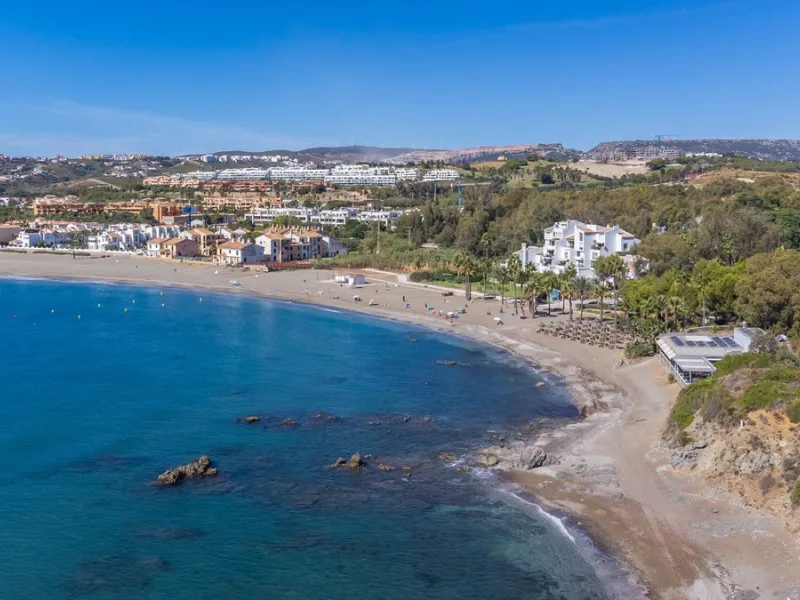 Stunning mid-floor apartment in the first line of the beach, with spectacular views of the sea, the beach, Gibraltar, and Africa, located in the exclusive Bay of Casares next to a protected historic area with an ancient Arab tower, within the prestigious 