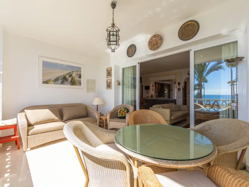 Stunning mid-floor apartment in the first line of the beach, with spectacular views of the sea, the beach, Gibraltar, and Africa, located in the exclusive Bay of Casares next to a protected historic area with an ancient Arab tower, within the prestigious 
