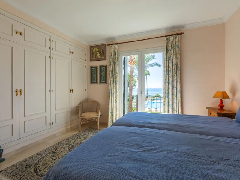 Stunning mid-floor apartment in the first line of the beach, with spectacular views of the sea, the beach, Gibraltar, and Africa, located in the exclusive Bay of Casares next to a protected historic area with an ancient Arab tower, within the prestigious 