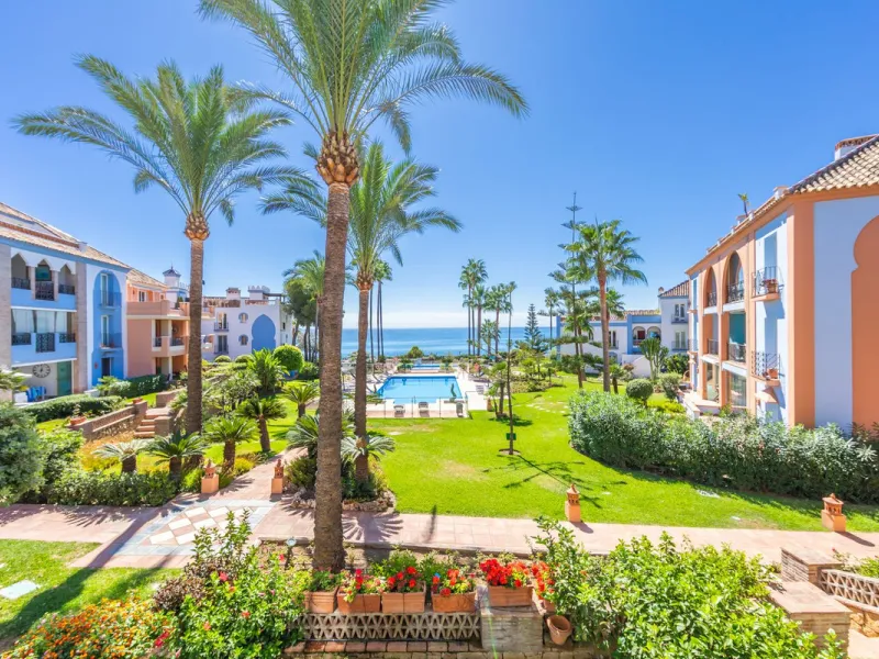 Stunning mid-floor apartment in the first line of the beach, with spectacular views of the sea, the beach, Gibraltar, and Africa, located in the exclusive Bay of Casares next to a protected historic area with an ancient Arab tower, within the prestigious 