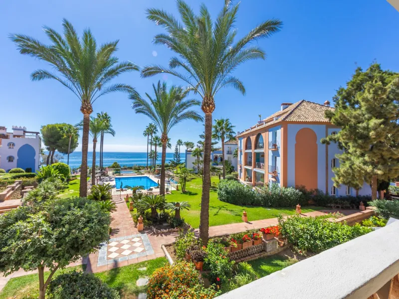 Stunning mid-floor apartment in the first line of the beach, with spectacular views of the sea, the beach, Gibraltar, and Africa, located in the exclusive Bay of Casares next to a protected historic area with an ancient Arab tower, within the prestigious 