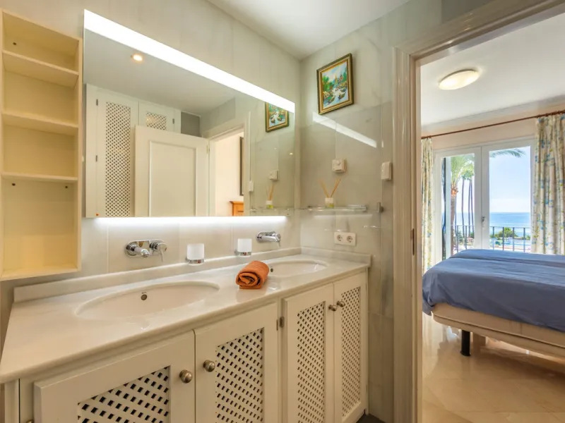 Stunning mid-floor apartment in the first line of the beach, with spectacular views of the sea, the beach, Gibraltar, and Africa, located in the exclusive Bay of Casares next to a protected historic area with an ancient Arab tower, within the prestigious 