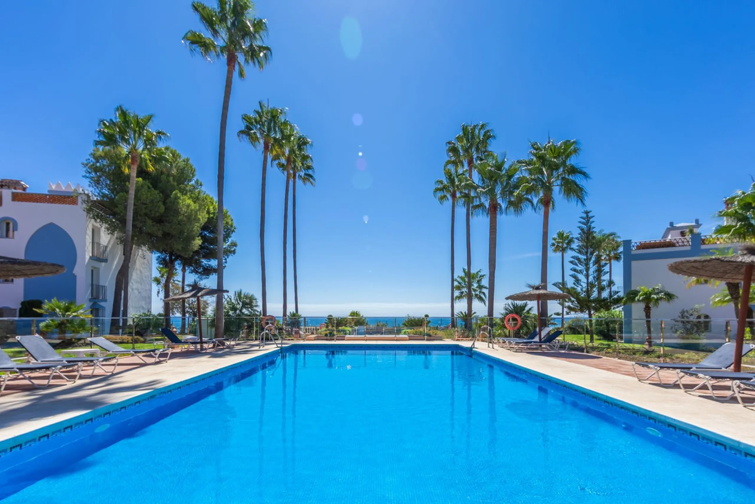 Stunning mid-floor apartment in the first line of the beach, with spectacular views of the sea, the beach, Gibraltar, and Africa, located in the exclusive Bay of Casares next to a protected historic area with an ancient Arab tower, within the prestigious 