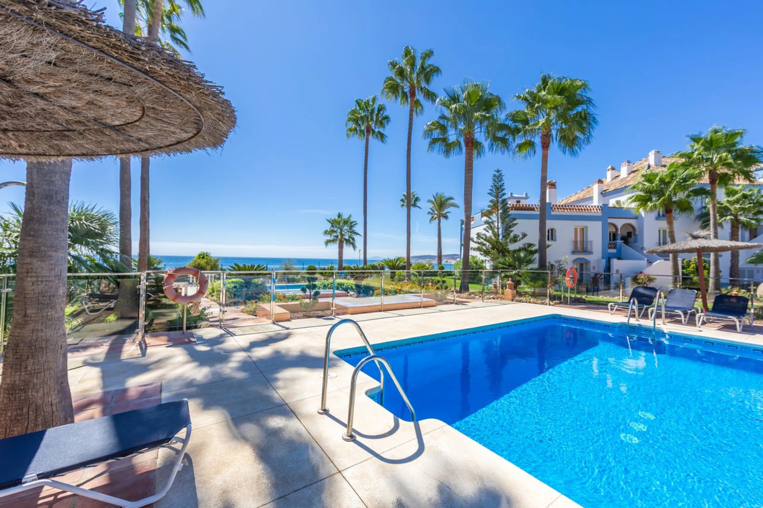 Stunning mid-floor apartment in the first line of the beach, with spectacular views of the sea, the beach, Gibraltar, and Africa, located in the exclusive Bay of Casares next to a protected historic area with an ancient Arab tower, within the prestigious 