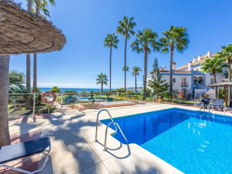 Stunning mid-floor apartment in the first line of the beach, with spectacular views of the sea, the beach, Gibraltar, and Africa, located in the exclusive Bay of Casares next to a protected historic area with an ancient Arab tower, within the prestigious 