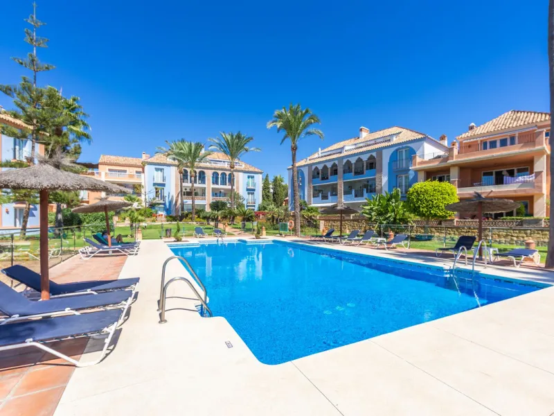 Stunning mid-floor apartment in the first line of the beach, with spectacular views of the sea, the beach, Gibraltar, and Africa, located in the exclusive Bay of Casares next to a protected historic area with an ancient Arab tower, within the prestigious 