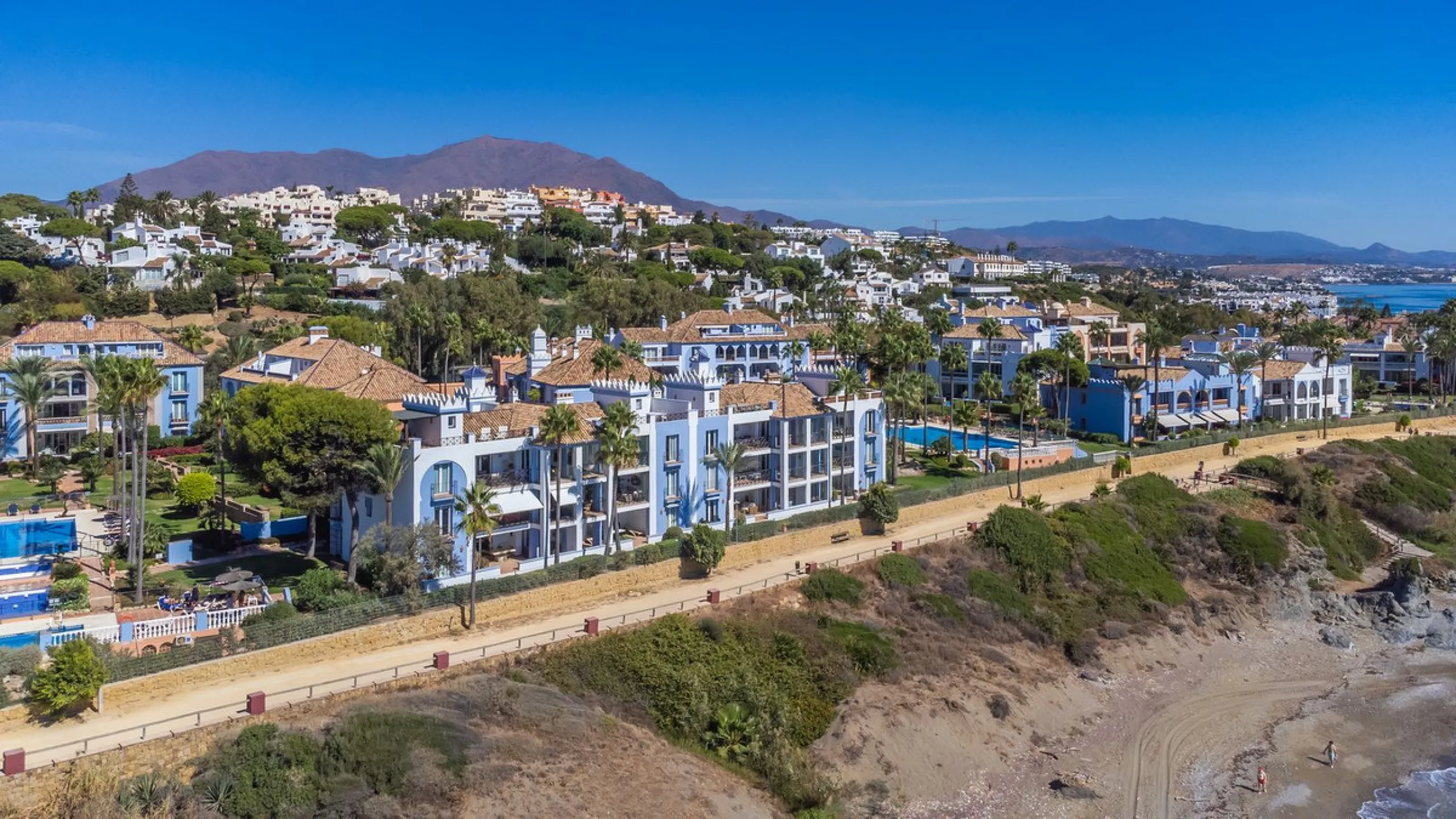 Stunning mid-floor apartment in the first line of the beach, with spectacular views of the sea, the beach, Gibraltar, and Africa, located in the exclusive Bay of Casares next to a protected historic area with an ancient Arab tower, within the prestigious 