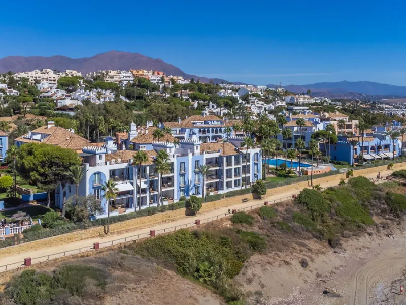 Stunning mid-floor apartment in the first line of the beach, with spectacular views of the sea, the beach, Gibraltar, and Africa, located in the exclusive Bay of Casares next to a protected historic area with an ancient Arab tower, within the prestigious 