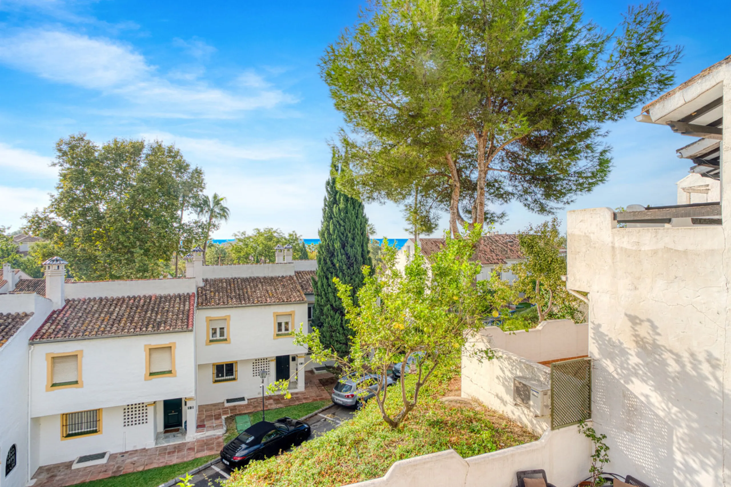 This three-bedroom, south-facing townhouse is set in the sought-after gated community of El Capricho on Marbella's Golden Mile is bursting with potential, offering spacious tropical gardens and two communal swimming pools. Ideally located within walking d