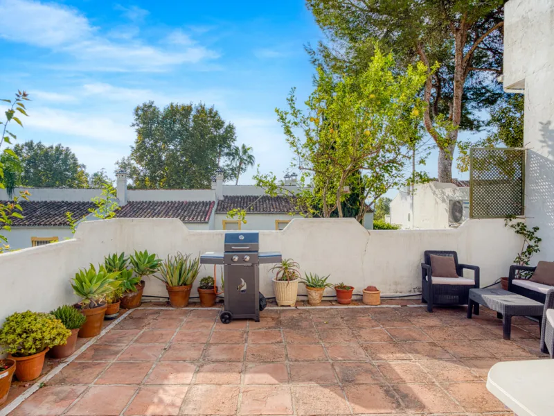 This three-bedroom, south-facing townhouse is set in the sought-after gated community of El Capricho on Marbella's Golden Mile is bursting with potential, offering spacious tropical gardens and two communal swimming pools. Ideally located within walking d