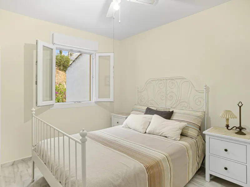 This three-bedroom, south-facing townhouse is set in the sought-after gated community of El Capricho on Marbella's Golden Mile is bursting with potential, offering spacious tropical gardens and two communal swimming pools. Ideally located within walking d