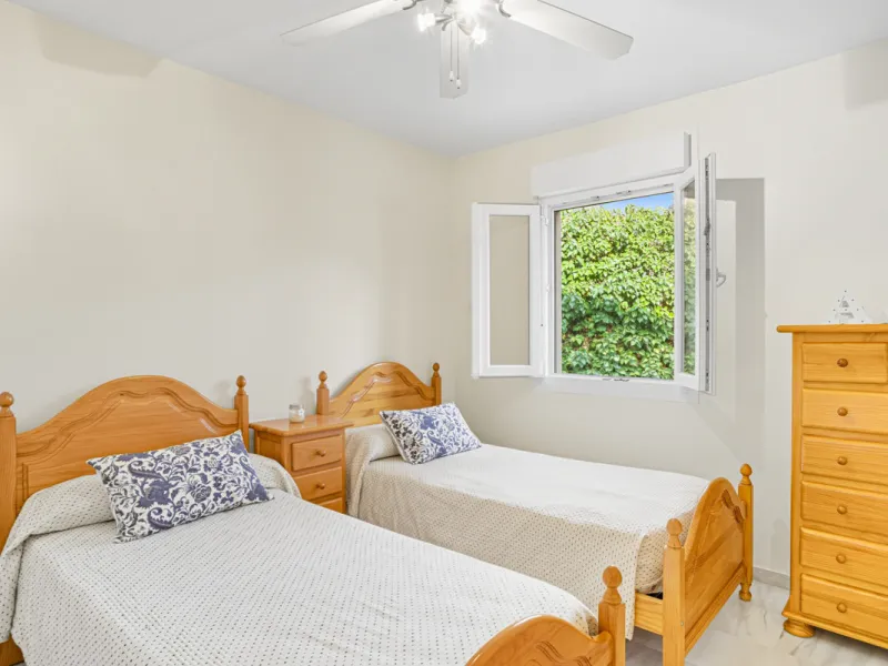 This three-bedroom, south-facing townhouse is set in the sought-after gated community of El Capricho on Marbella's Golden Mile is bursting with potential, offering spacious tropical gardens and two communal swimming pools. Ideally located within walking d