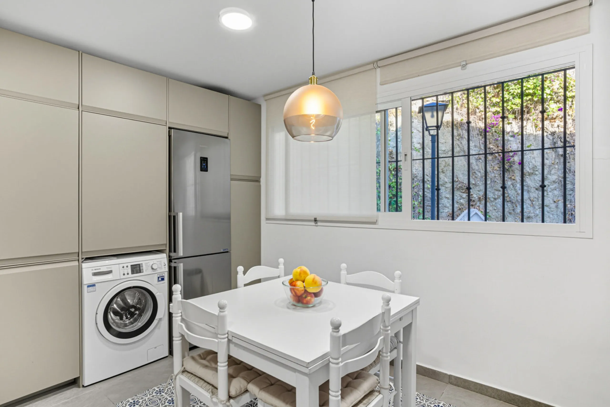 This three-bedroom, south-facing townhouse is set in the sought-after gated community of El Capricho on Marbella's Golden Mile is bursting with potential, offering spacious tropical gardens and two communal swimming pools. Ideally located within walking d