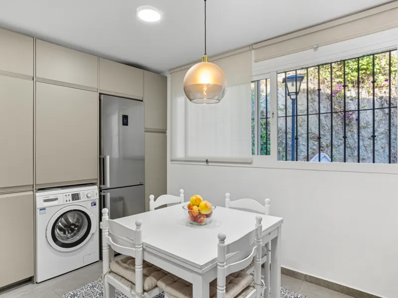 This three-bedroom, south-facing townhouse is set in the sought-after gated community of El Capricho on Marbella's Golden Mile is bursting with potential, offering spacious tropical gardens and two communal swimming pools. Ideally located within walking d
