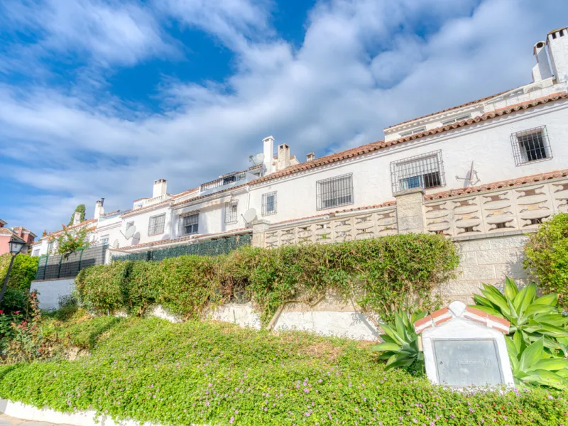 This three-bedroom, south-facing townhouse is set in the sought-after gated community of El Capricho on Marbella's Golden Mile is bursting with potential, offering spacious tropical gardens and two communal swimming pools. Ideally located within walking d