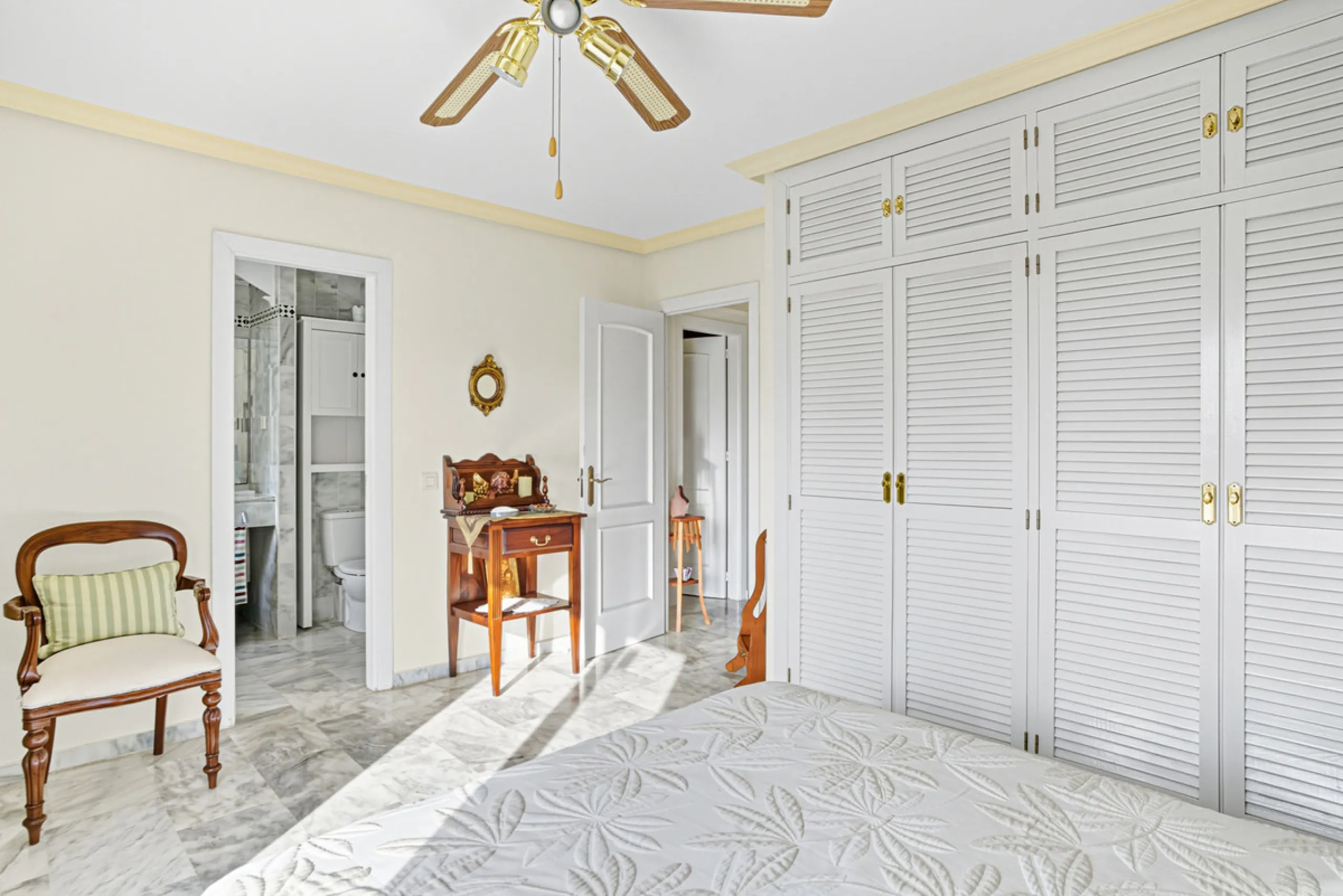 This three-bedroom, south-facing townhouse is set in the sought-after gated community of El Capricho on Marbella's Golden Mile is bursting with potential, offering spacious tropical gardens and two communal swimming pools. Ideally located within walking d