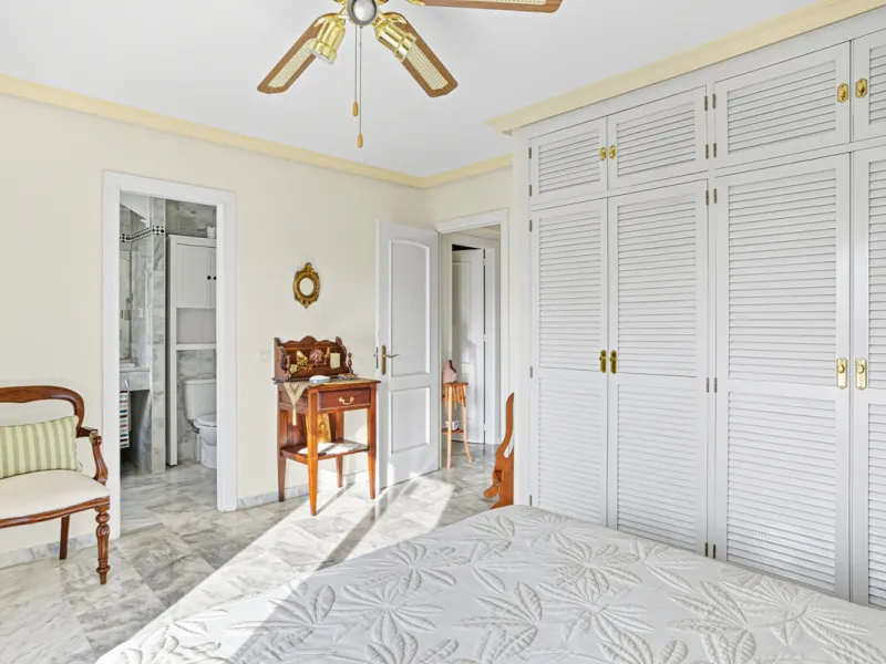 This three-bedroom, south-facing townhouse is set in the sought-after gated community of El Capricho on Marbella's Golden Mile is bursting with potential, offering spacious tropical gardens and two communal swimming pools. Ideally located within walking d