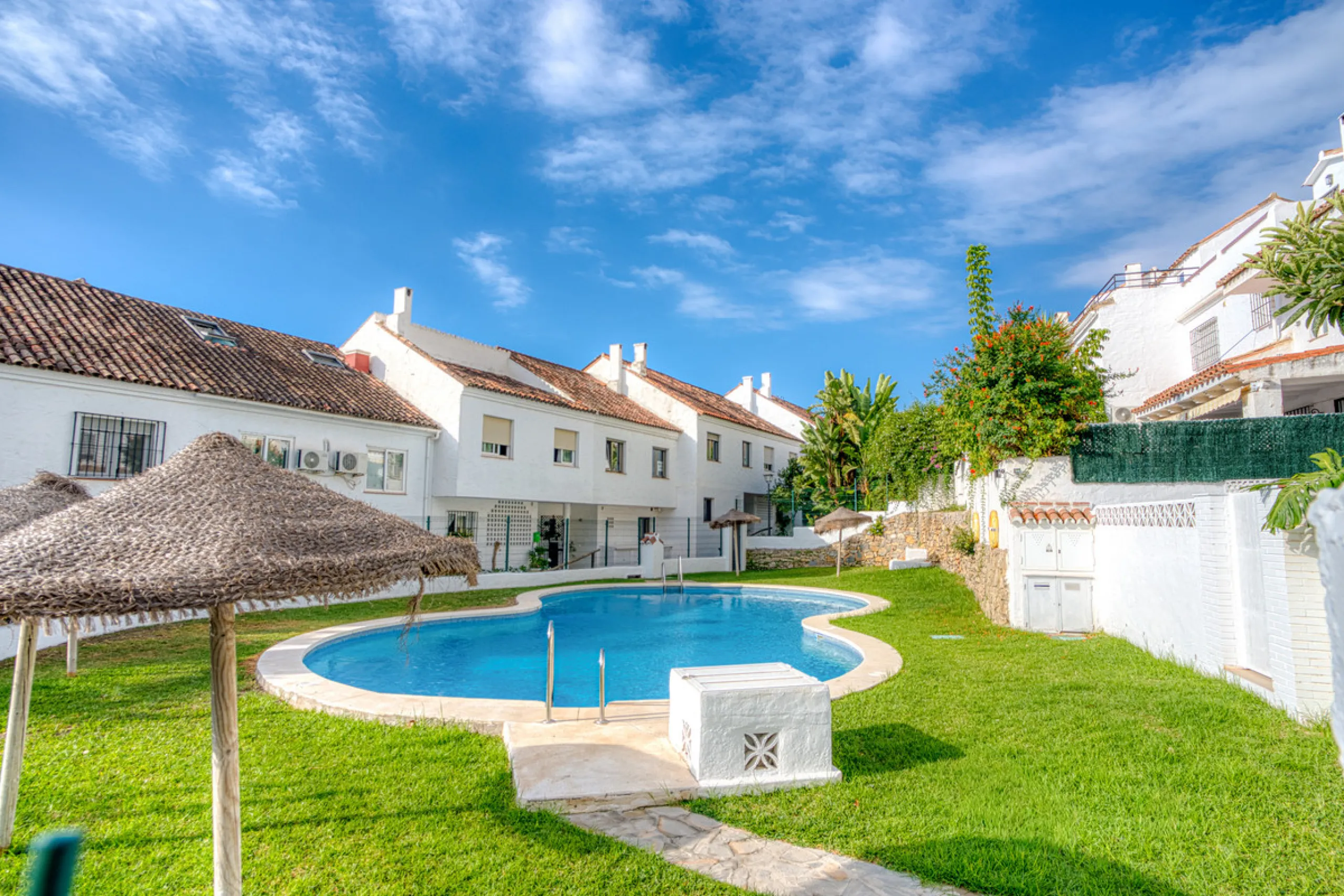 This three-bedroom, south-facing townhouse is set in the sought-after gated community of El Capricho on Marbella's Golden Mile is bursting with potential, offering spacious tropical gardens and two communal swimming pools. Ideally located within walking d