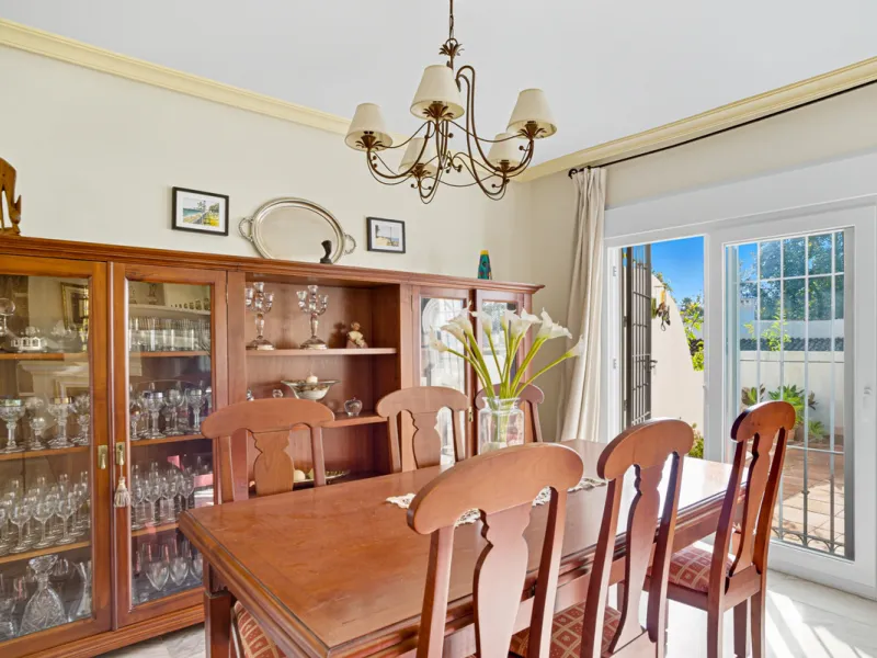 This three-bedroom, south-facing townhouse is set in the sought-after gated community of El Capricho on Marbella's Golden Mile is bursting with potential, offering spacious tropical gardens and two communal swimming pools. Ideally located within walking d
