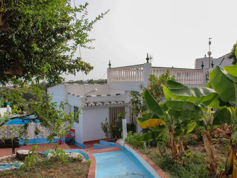Villa with garden, private pool and three large terraces with sea views.
