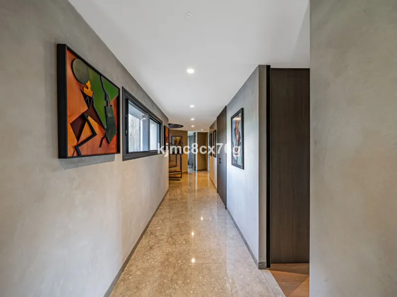Located in the prestigious Guadalmina area, this exceptional villa seamlessly blends modern elegance with the serenity of a golf-front retreat. Just moments from world-class courses, golden beaches, and upscale amenities, it offers the perfect balance of 