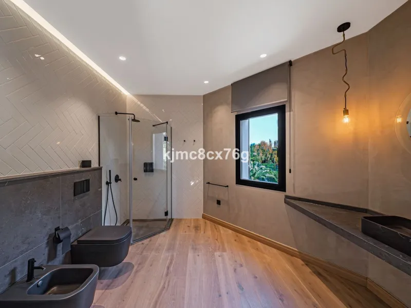 Located in the prestigious Guadalmina area, this exceptional villa seamlessly blends modern elegance with the serenity of a golf-front retreat. Just moments from world-class courses, golden beaches, and upscale amenities, it offers the perfect balance of 