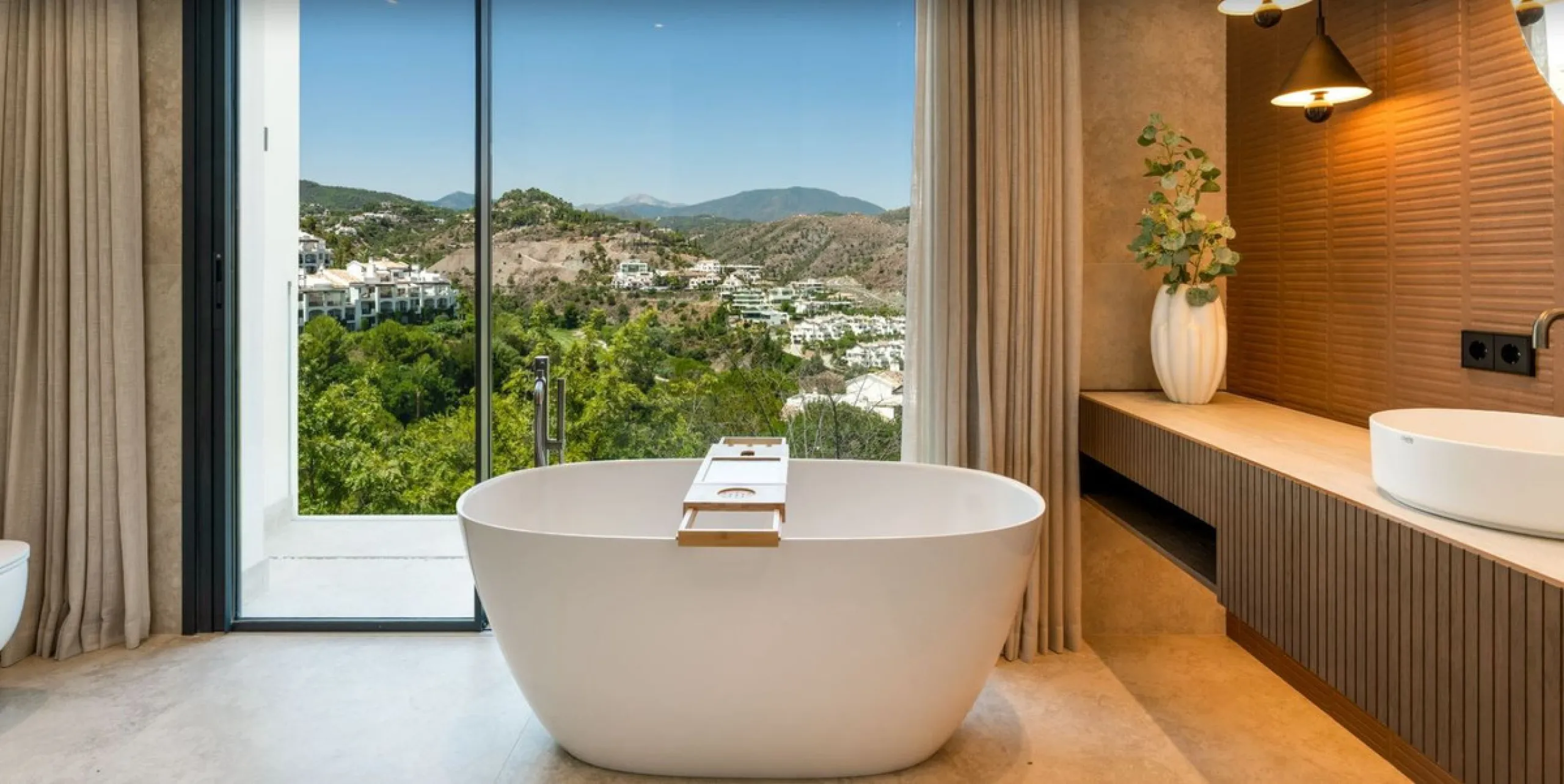 Nestled in the prestigious enclave of El Herrojo, within La Quinta, this remarkable six-bedroom villa embodies a seamless blend of traditional Andalusian charm and refined contemporary design. Recently refurbished to impeccable standards using premium mat