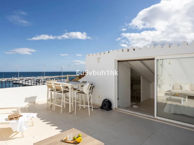 Discover this beautifully renovated duplex penthouse perfectly positioned in the vibrant heart of Puerto Banús, boasting spectacular views directly over the iconic marina.
