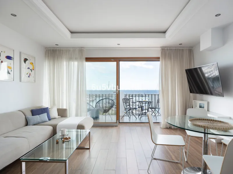 Discover this beautifully renovated duplex penthouse perfectly positioned in the vibrant heart of Puerto Banús, boasting spectacular views directly over the iconic marina.