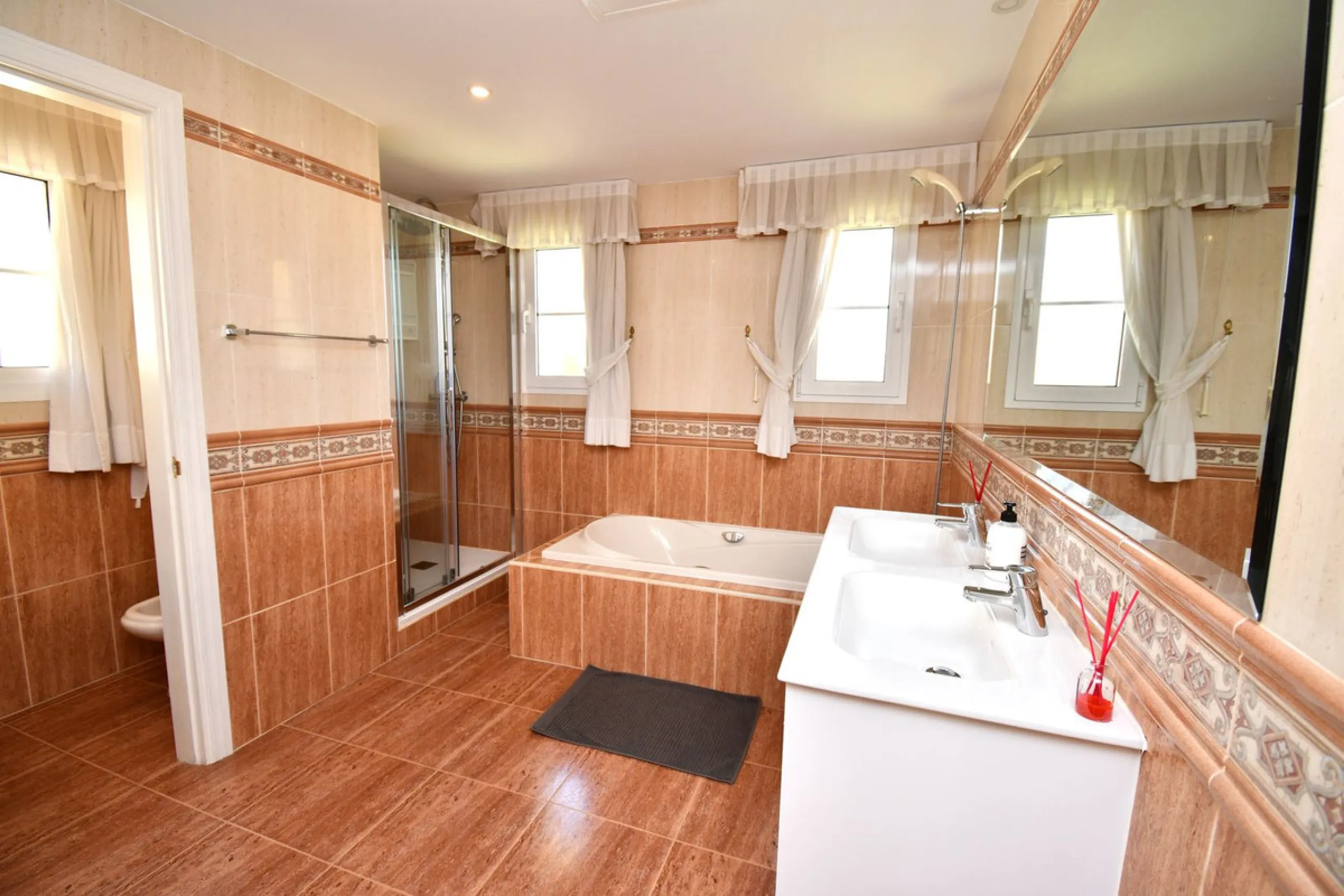 This impressive, front-line golf, 9 bedroom, 10 bathroom villa offers over 700m2 of living and entertainment space and sits on a spacious plot of 1,300m2.  This villa has 8 ensuite bedrooms, offering family/guests their own space and privacy.  All indoor 