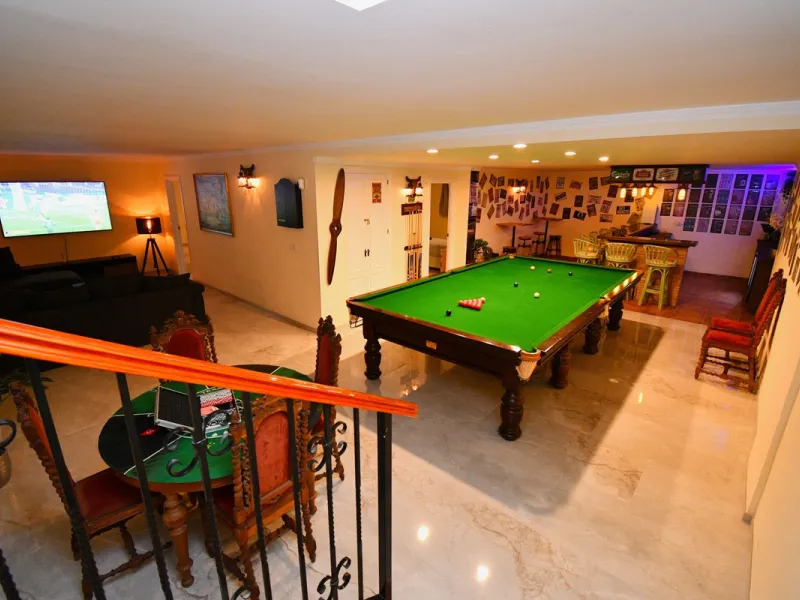 This impressive, front-line golf, 9 bedroom, 10 bathroom villa offers over 700m2 of living and entertainment space and sits on a spacious plot of 1,300m2.  This villa has 8 ensuite bedrooms, offering family/guests their own space and privacy.  All indoor 