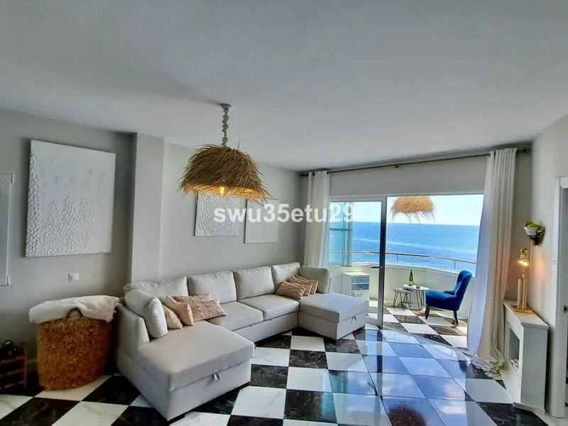 This fantastic first-line beach apartment with stunning sea views offers direct access to the communal gardens and beach.