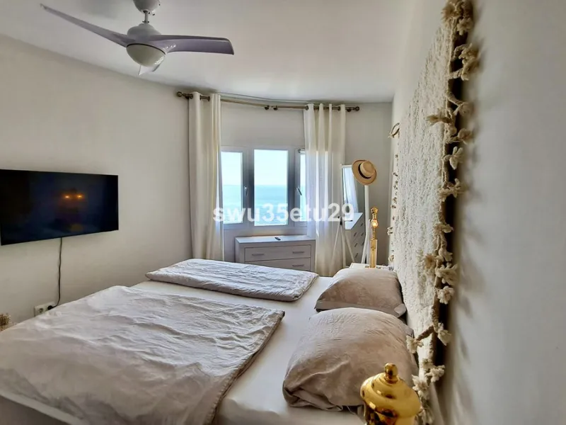 This fantastic first-line beach apartment with stunning sea views offers direct access to the communal gardens and beach.