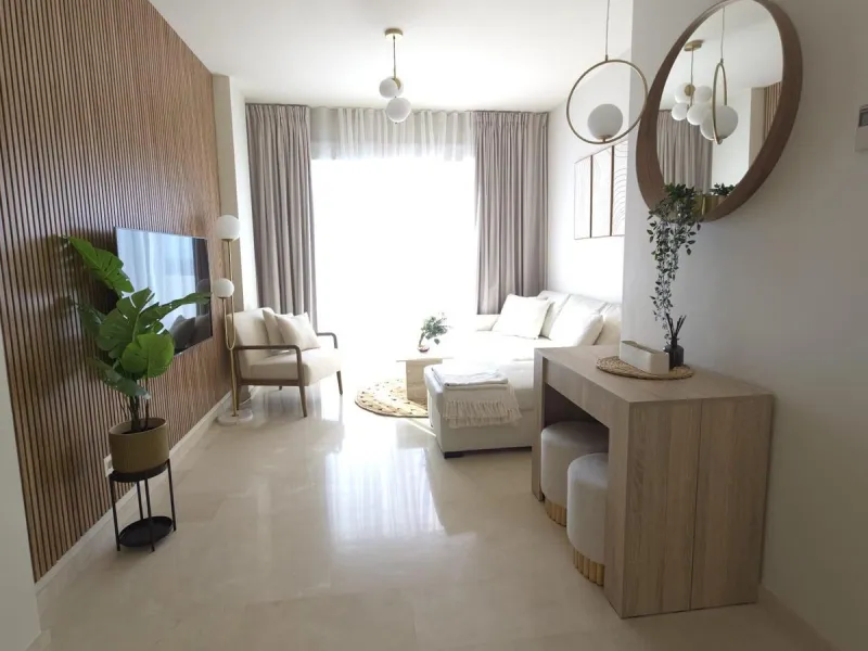 This elegant and sun-filled apartment is located in a peaceful and well-maintained residential area, just a short drive from the city center. Set near a renowned golf course, it's a perfect choice for those who enjoy a relaxed lifestyle with easy access t