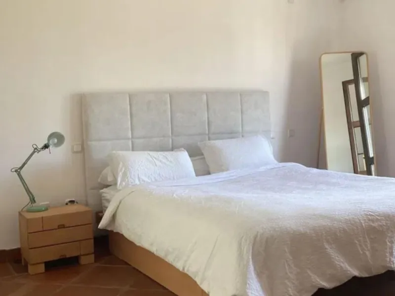 This semi-detached, south-facing townhouse with abundant natural light spans 184 square meters and includes a garage and storage.