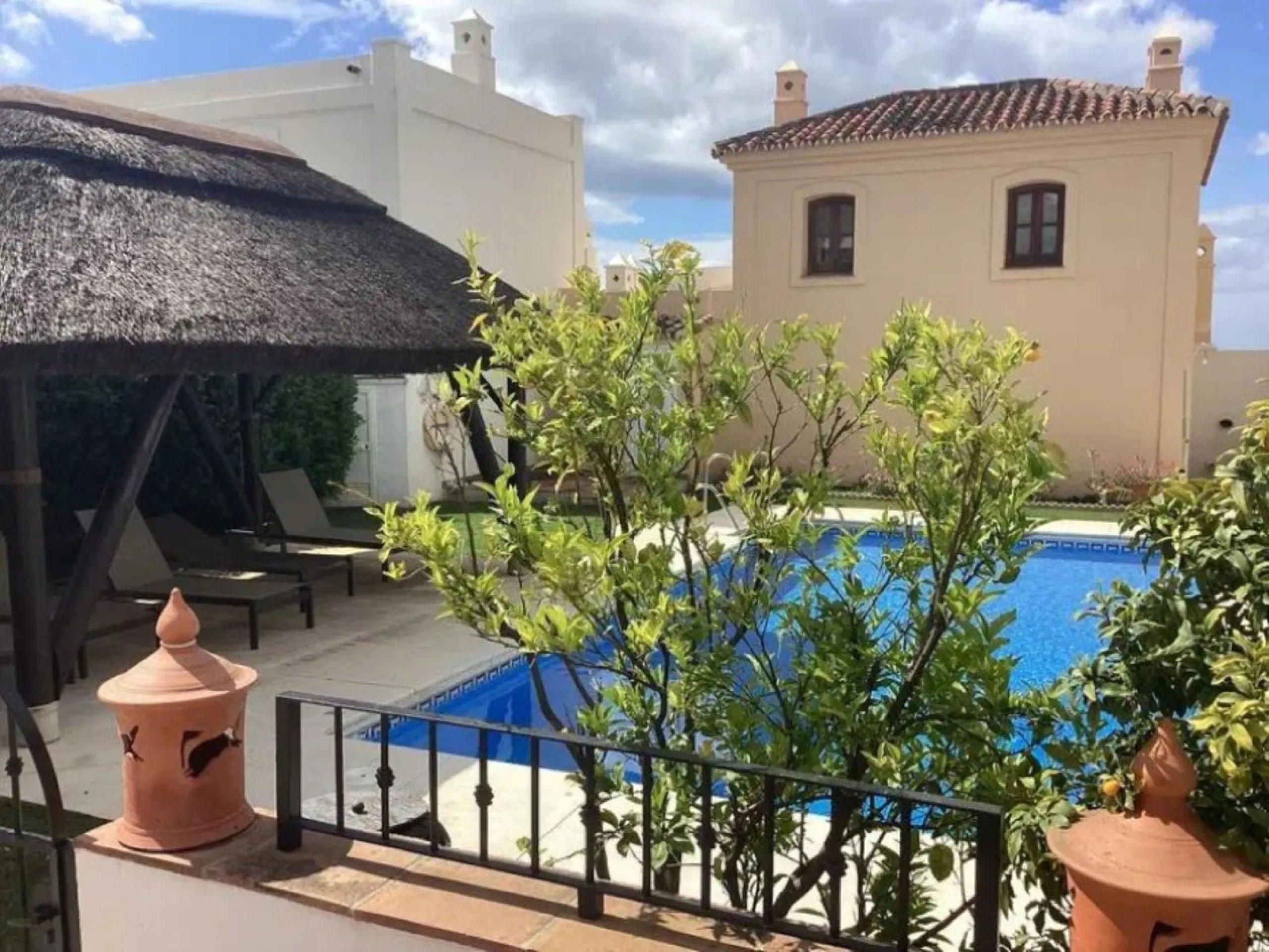 This semi-detached, south-facing townhouse with abundant natural light spans 184 square meters and includes a garage and storage.