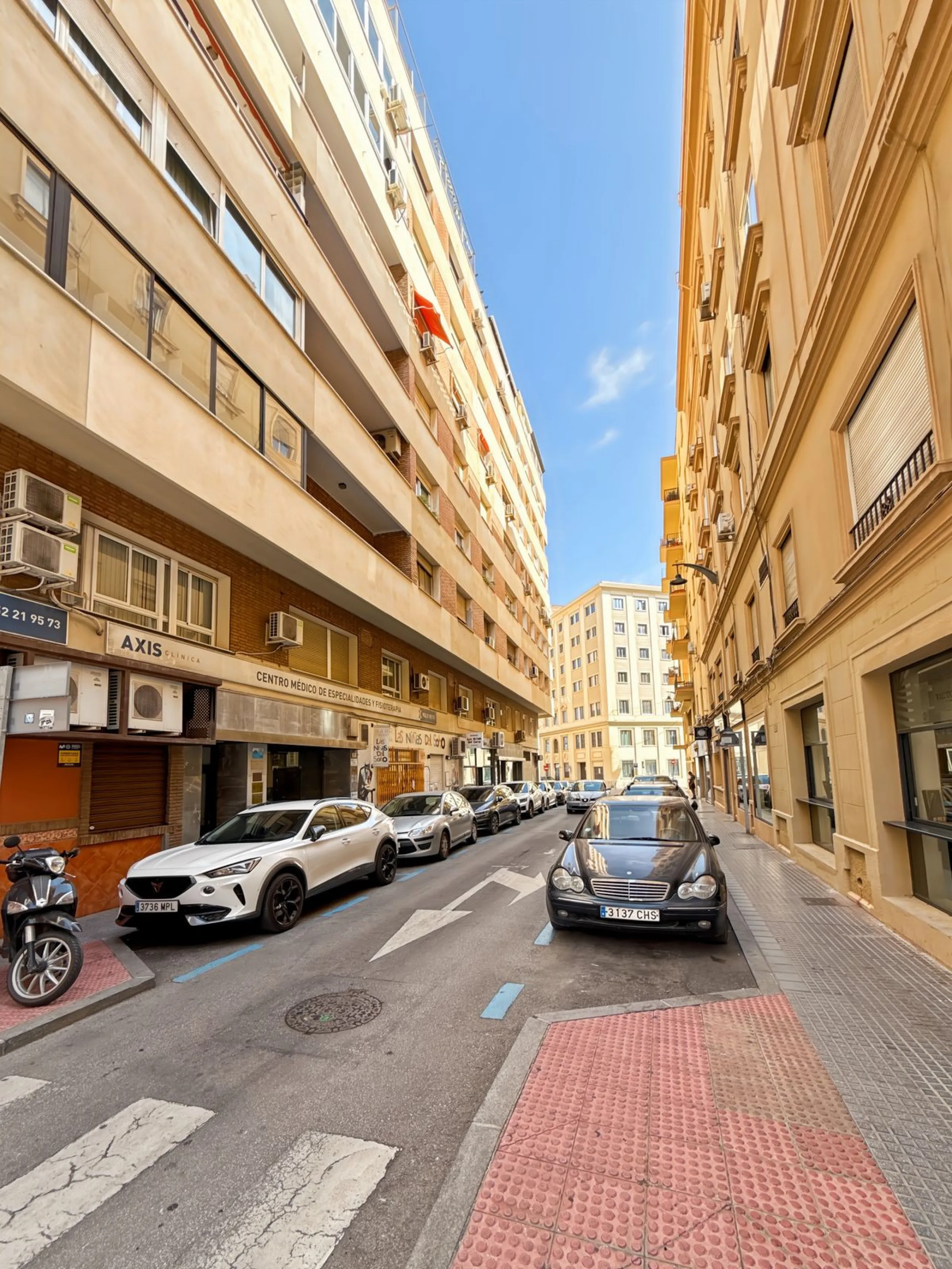 Some places can't be described by square meters or floor plans. They're described by how they make you feel the moment you walk in. This flat on Calle San Lorenzo, right in the beating heart of Málaga's Soho, has something rare — it has soul.