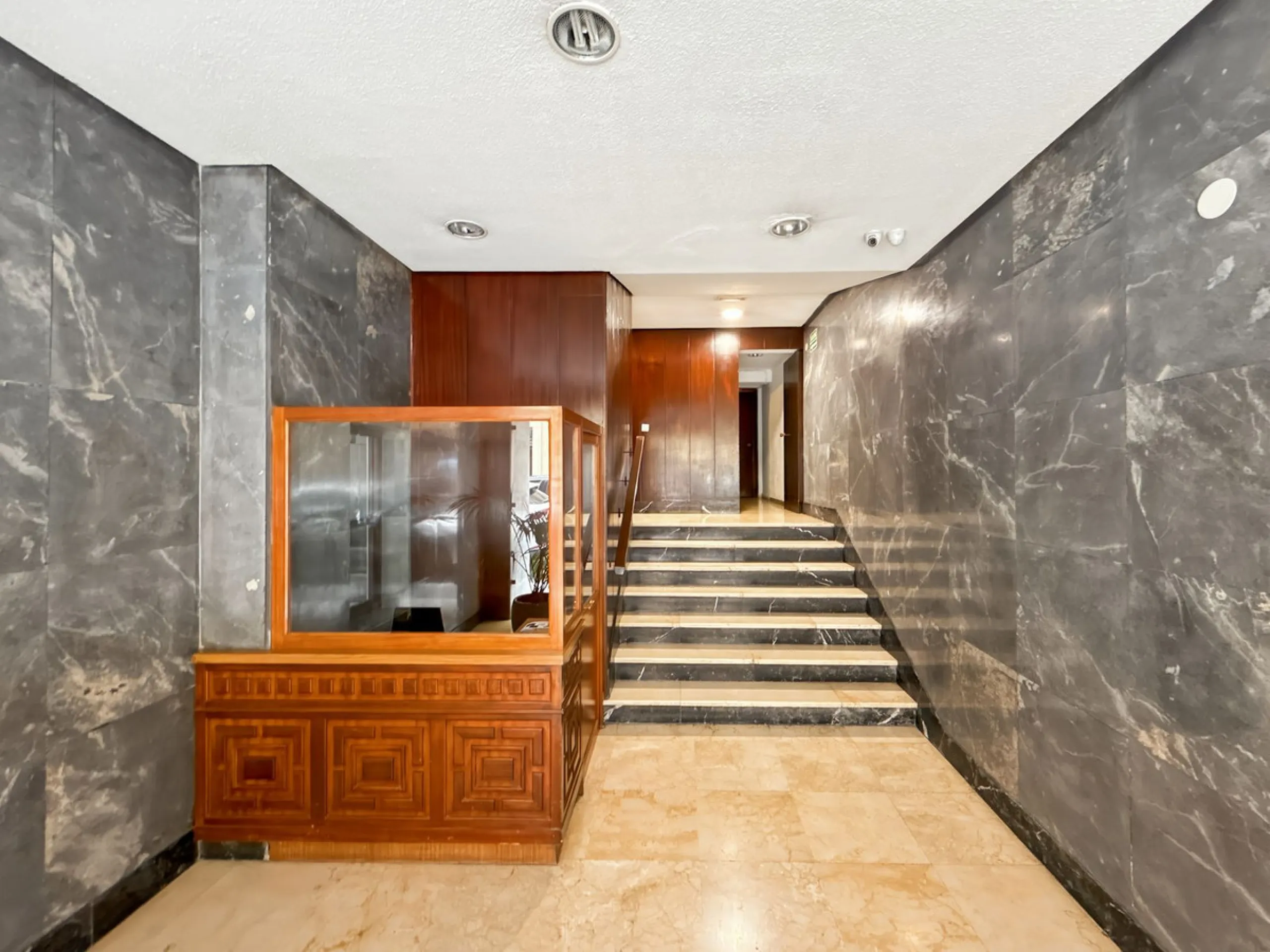 Some places can't be described by square meters or floor plans. They're described by how they make you feel the moment you walk in. This flat on Calle San Lorenzo, right in the beating heart of Málaga's Soho, has something rare — it has soul.