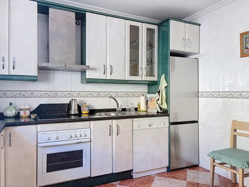 Located in the desirable residential area of El Tomillar, Torre del Mar, this spacious townhouse offers more than 210 m2 of built space across multiple levels, designed for comfortable family living. The property boasts six bedrooms and three full bathroo