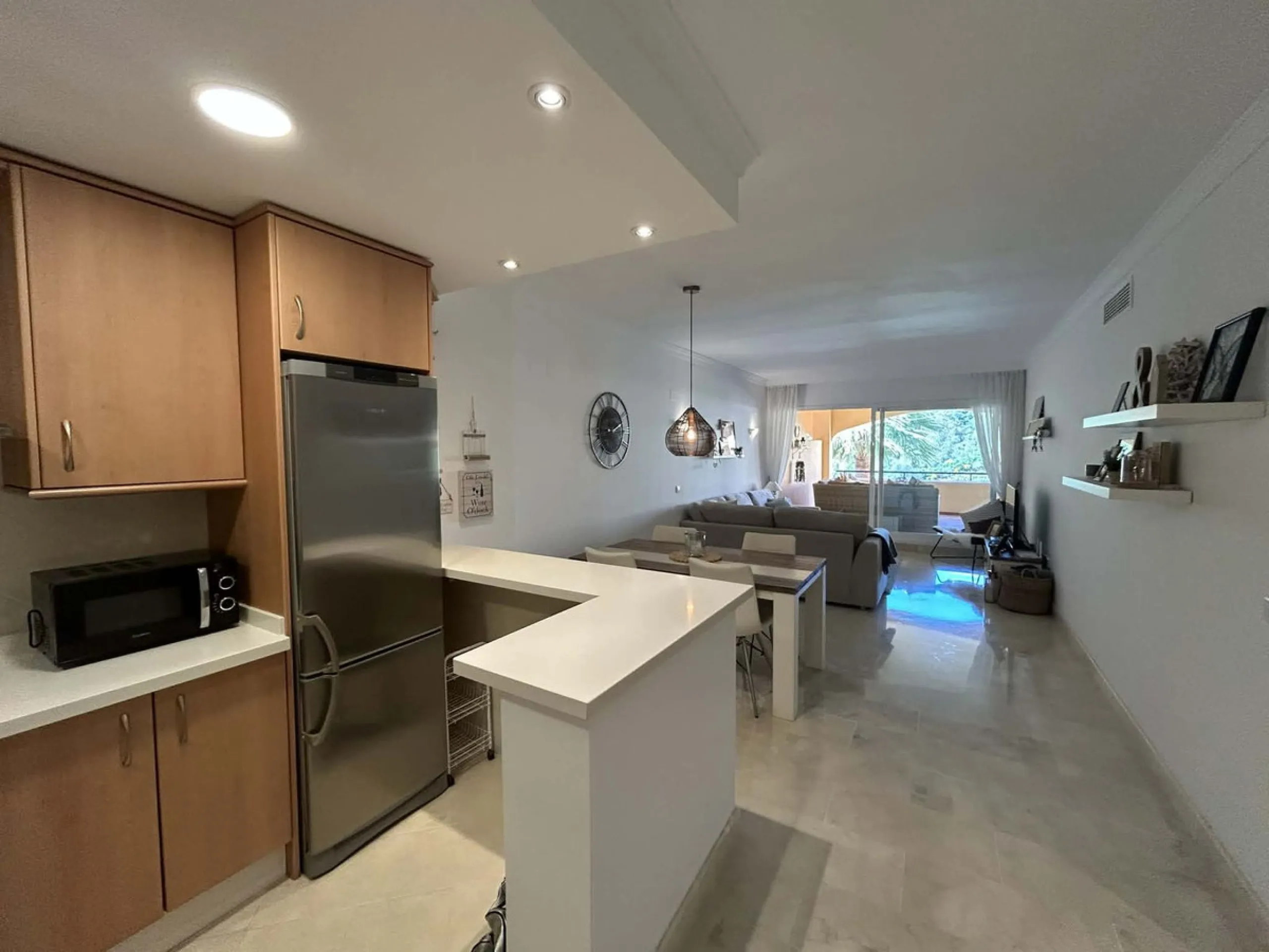 Elegant and bright west facing apartment situated in Santa Maria Village, a gated 24hour security community nested in Elviria, only minutes away from Marbella's nicest sandy beaches. This immaculate apartment combines comfort, style and convenience and fe