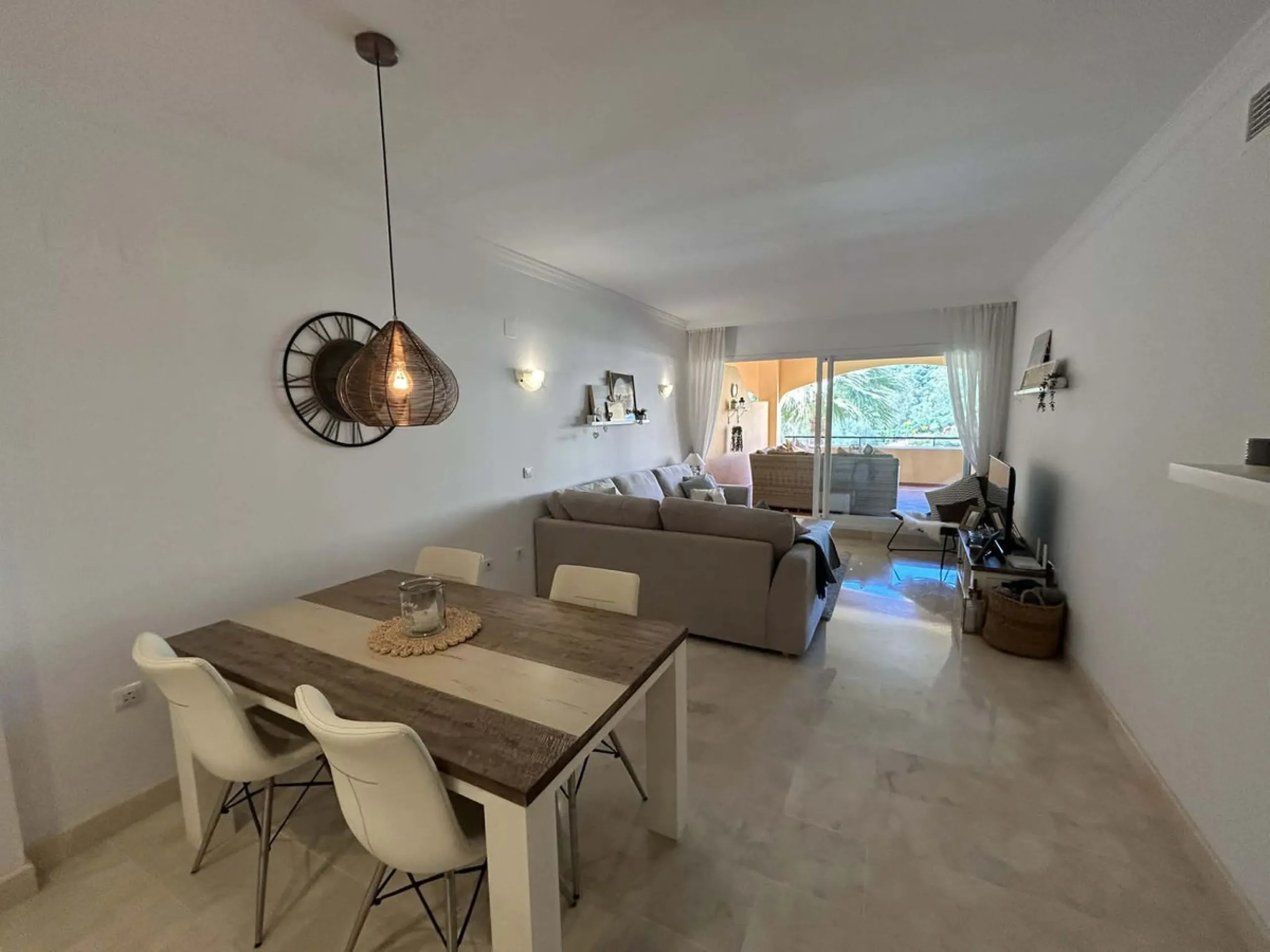 Elegant and bright west facing apartment situated in Santa Maria Village, a gated 24hour security community nested in Elviria, only minutes away from Marbella's nicest sandy beaches. This immaculate apartment combines comfort, style and convenience and fe