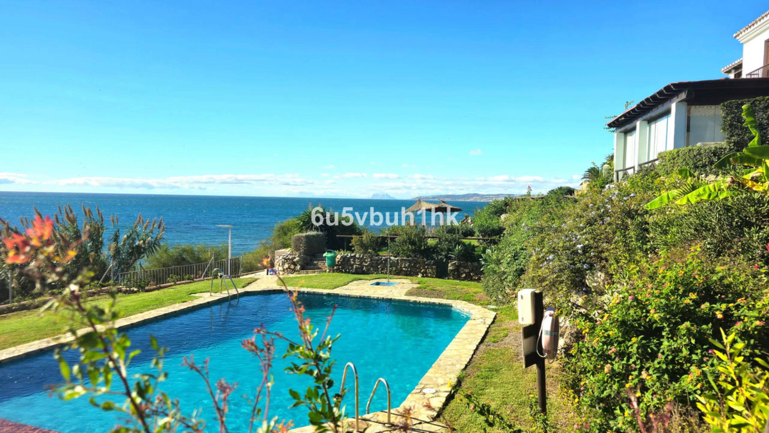 Located in the established Bahia Azul urbanisation, this traditional Spanish house offers an excellent opportunity to acquire a property with direct access to the beach and communal amenities.