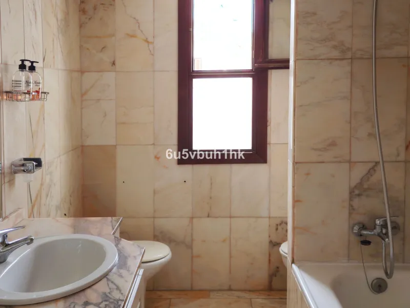Located in the established Bahia Azul urbanisation, this traditional Spanish house offers an excellent opportunity to acquire a property with direct access to the beach and communal amenities.