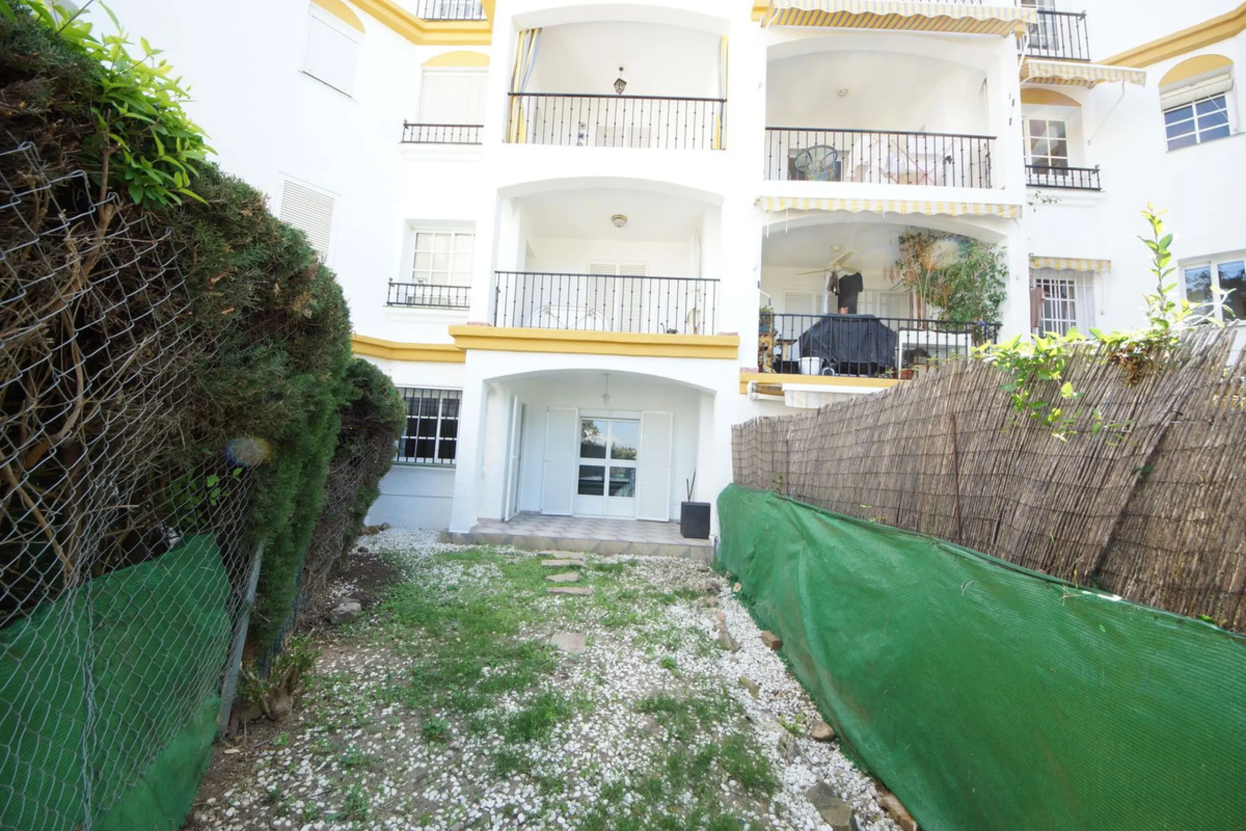 Spacious ground-floor apartment in a residential complex with a pool.
