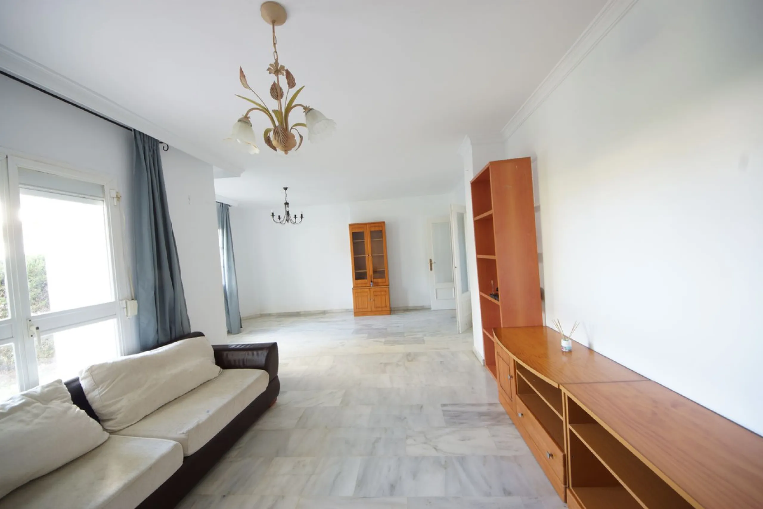 Spacious ground-floor apartment in a residential complex with a pool.